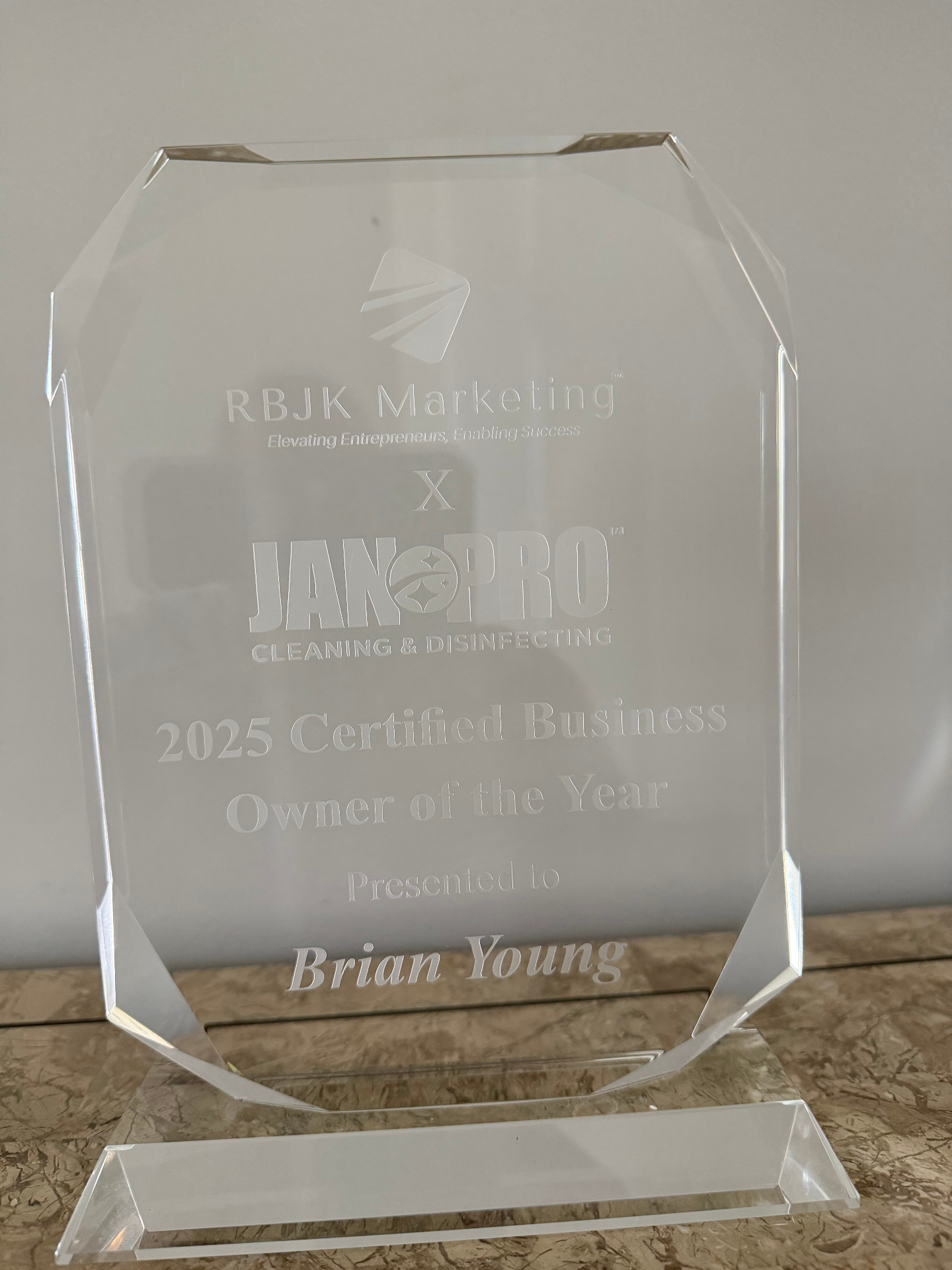 Certified Business Owner of the Year crystal award presented to Brian Young